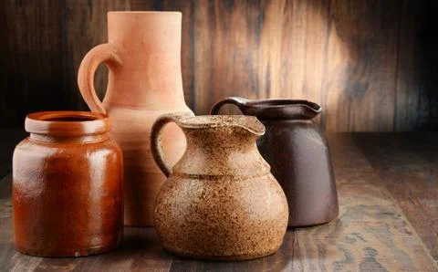 Composition with old pottery. Kitchen dishes. Stock Photos