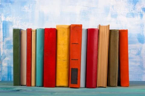 Composition with old vintage colorful hardback books, diary on w Stock Photos