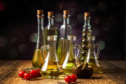 Composition of olive oils in bottles Stock Photos
