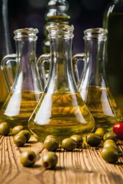 Composition of olive oils in bottles Stock Photos