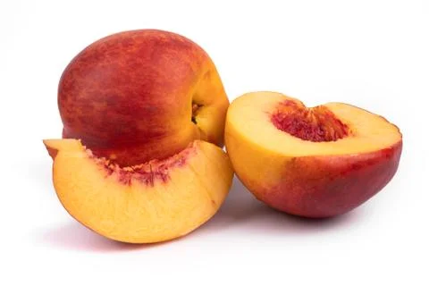 A composition of one whole, a half and a slice of juicy nectarines Stock Photos