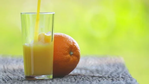 Composition with orange and orange juice outdoors. Stock Footage 114610380