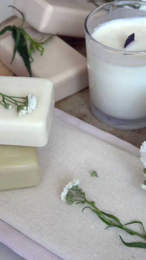 Composition of organic handmade soap bars and scented soy wax candle on fab.. Stock Footage 339650287