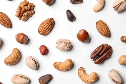 Composition with organic mixed nuts on white background, top view 스톡 사진