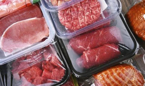 Composition with packages of assorted meat products Stock Photos