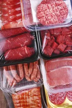 Composition with packages of assorted meat products Stock Photos