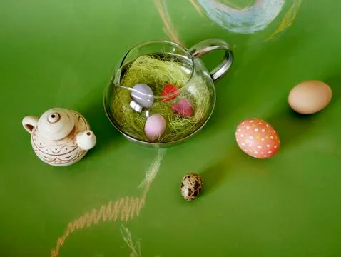 Composition of painted chicken and quail eggs, Easter decor Stock Photos