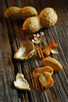 Composition of peanuts in the background of vintage board Stock Photos