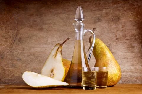 Composition with pear brandy Stock Photos