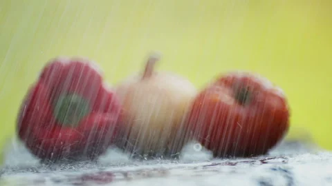 Composition of pepper, tomato and onion on a table under a stream of water. Stock Footage 114439962