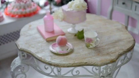 A composition of pink items. Mug, Book, peach cake. Abstract background Stock Footage 69814885