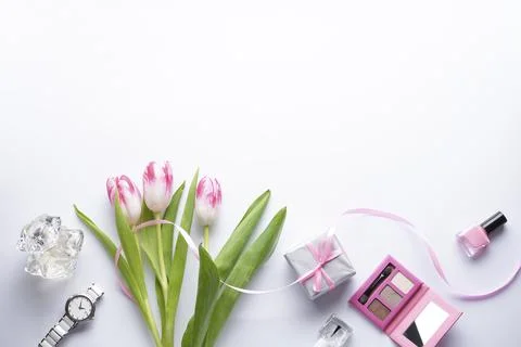 Composition with pink tulips on a white background with space for text, top v Stock Photos