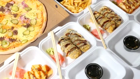 Composition of Pizza and Sushi Roll fast food Stock Footage 165614139