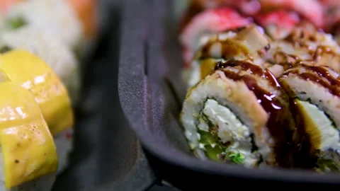 Composition of Pizza vs Sushi Roll set fast food in container in box. Business Stock Footage 308839796