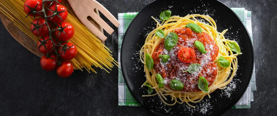 Composition with a plate of spaghetti bolognese. Stock Photos