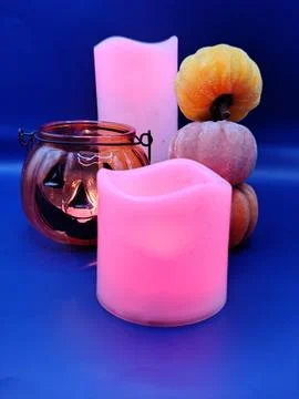 A composition of pumpkins and colored candles. Halloween Foto stock