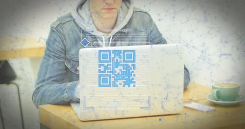 Composition of qr code and data processing over caucasian man using computer 스톡 사진