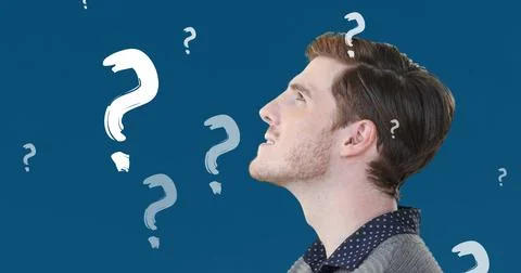 Composition of question marks over caucasian man on blue background 写真素材