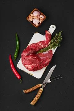 Composition with raw beef whole tenderloin Foto stock