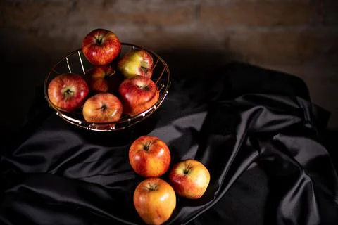 Composition of red apples and black satin Stock Photos