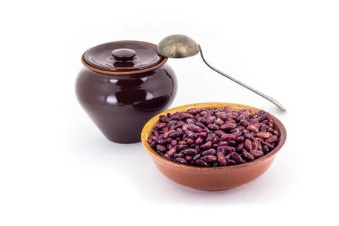 The composition of the Red beans in a clay pial next to a clay pot and a co.. Stock Photos