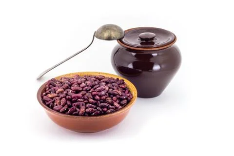 The composition of the Red beans in a clay pial next to a clay pot and a co.. Stock Photos