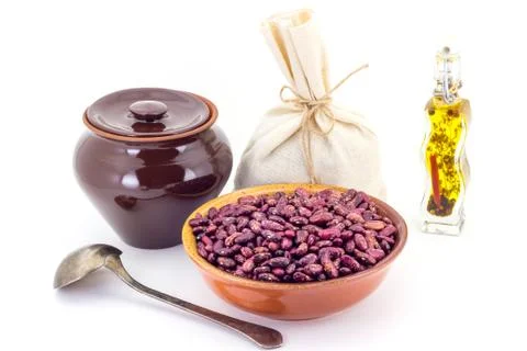 The composition of the Red beans in a clay pial next to a clay pot and a copp Stock Photos