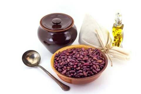 The composition of the Red beans in a clay pial next to a clay pot and a copp Stock Photos