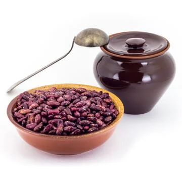 The composition of the Red beans in a clay pial next to a clay pot and a copp Stock Photos