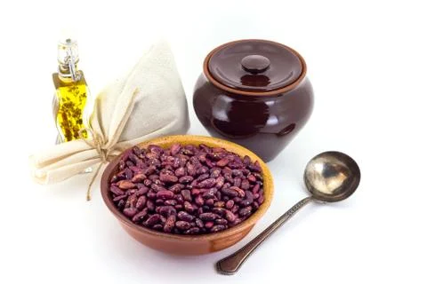 The composition of the Red beans in a clay pial next to a clay pot and a copp Stock Photos