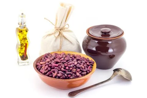 The composition of the Red beans in a clay pial next to a clay pot and a copp Stock Photos