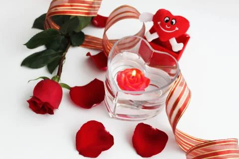Composition with red rose and red candle Stock Photos