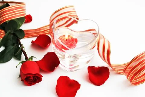 Composition with red rose and red candle Stock Photos