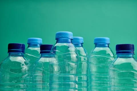 Composition of reusable plastic bottles Stock Photos