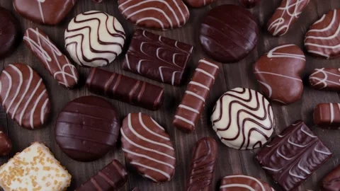 Composition rotating chocolate chip cookies of various shapes and chocolates and Stock Footage 167658522