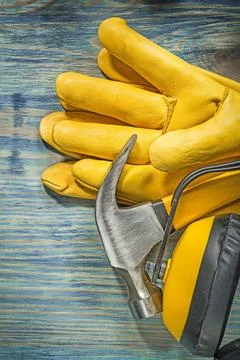 Composition of safety work clothing Claw hammer on wooden board Construction Photos