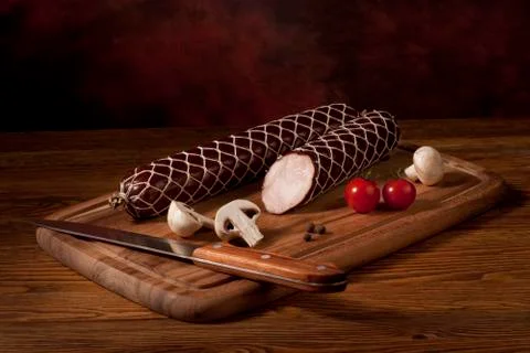 Composition with sausage on the table Stock Photos