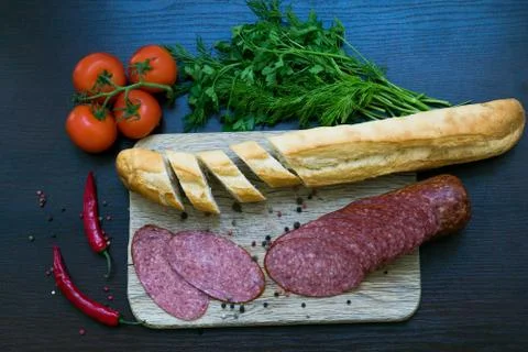 Composition with sausage on the table Stock Photos