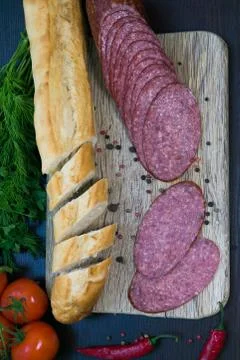 Composition with sausage on the table Stock Photos