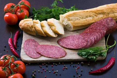 Composition with sausage on the table Stock Photos