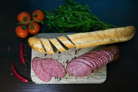 Composition with sausage on the table Stock Photos