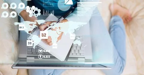 Composition of screen with digital data processing over woman writing using Stock Photos