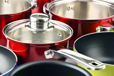 Composition with a set of steel pots. Stock Photos