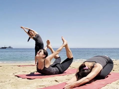 Composition of several bikram yoga poses at beach Stock Photos
