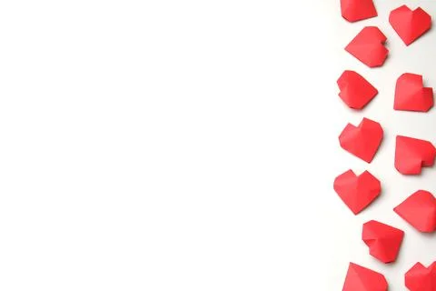 Composition from several handmade 3D red paper hearts on white background 스톡 사진