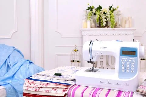 Composition from a sewing machine. Mannequin, flowers on a retro table and th Stock Photos