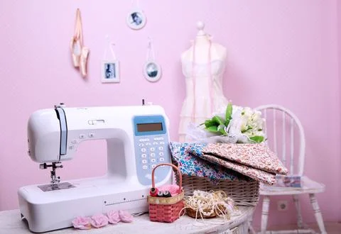 Composition from a sewing machine. Mannequin, flowers on a retro table and th Stock Photos