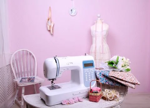 Composition from a sewing machine. Mannequin, flowers on a retro table and th Stock Photos