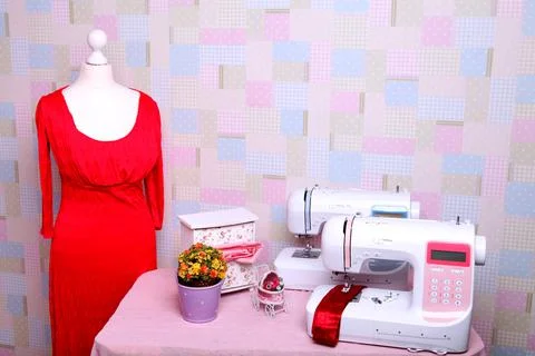 Composition from a sewing machine. Mannequin, flowers on a retro table and th Stock Photos