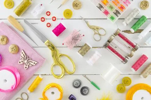 Composition with sewing threads and accessories on white background, top view Stock Photos